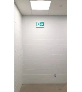 Enseigne avec pictogramme vert «personne qui court» pour sortie de secours, avec DEL, boîtier en métal, batterie incluse