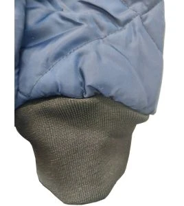Short blue fleece-lined refrigeration coat with 3 pockets, snap closure.
