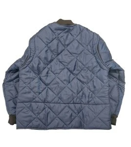 Short blue fleece-lined refrigeration coat with 3 pockets, snap closure.