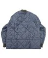 Short blue fleece-lined refrigeration coat with 3 pockets, snap closure.