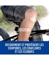 Pansement transparent Nexcare sur le genou d'un cycliste, protège coupures, éraflures et cloques