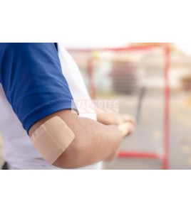 Nexcare Duo DSA-8-CA bandage worn on a young hockey player's elbow
