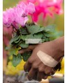 Hand wearing a Nexcare Duo DSA-8CP-CA bandage while gardening